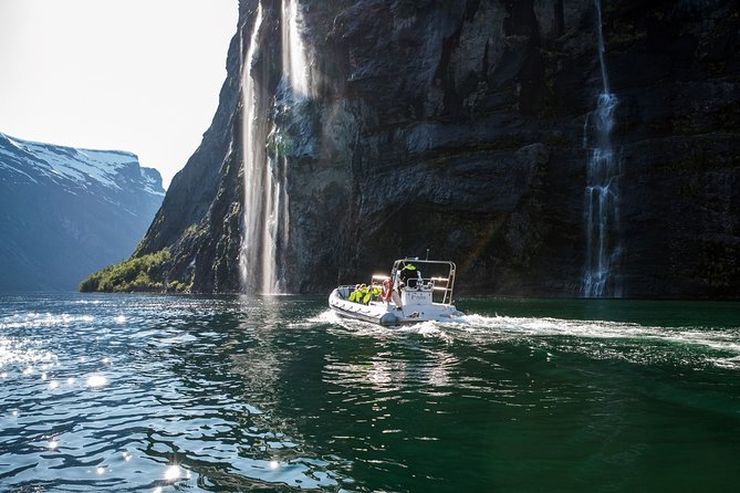 Geiranger: RIB Fjordsafari Geirangefjord - Getting ready for the cold, wind, and saddle-style seats