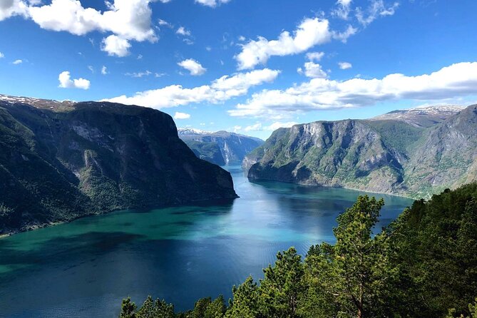 A silent electric boat under the cliffs of the Lysefjord, Norway