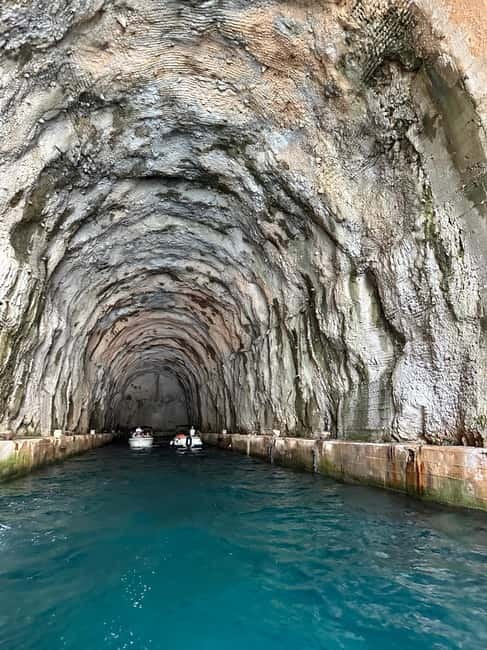 Kotor: Private Blue Cave & Bay of Kotor Boat Tour w/ Drink - Entering the former Yugoslav submarine tunnel