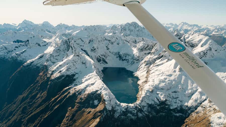 Milford Sound & Big 5 Glaciers Scenic Flight from Queenstown - Leaving Queenstown in a 12-seat Cessna