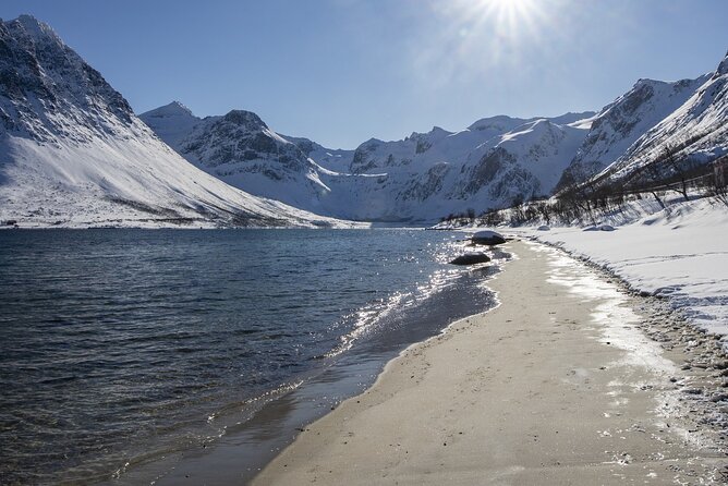 Tromso fjords road trip with fire in grill cabin by the beach. - Grotfjord, white sand, and a fire by the sea